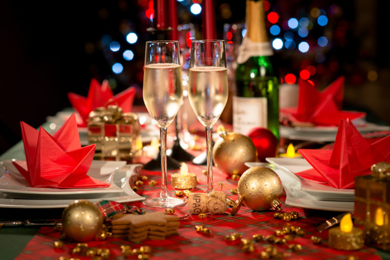 christmas party table with champagne in glasses
