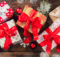 Christmas gift boxes placed on wooden planks in panoramatic composition